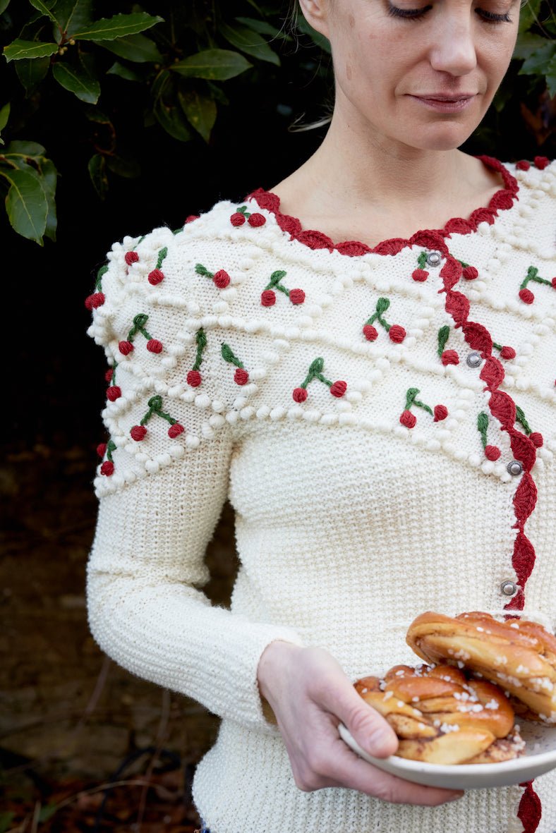 handknitted cream white merino wool cardigan with cherry embroidery