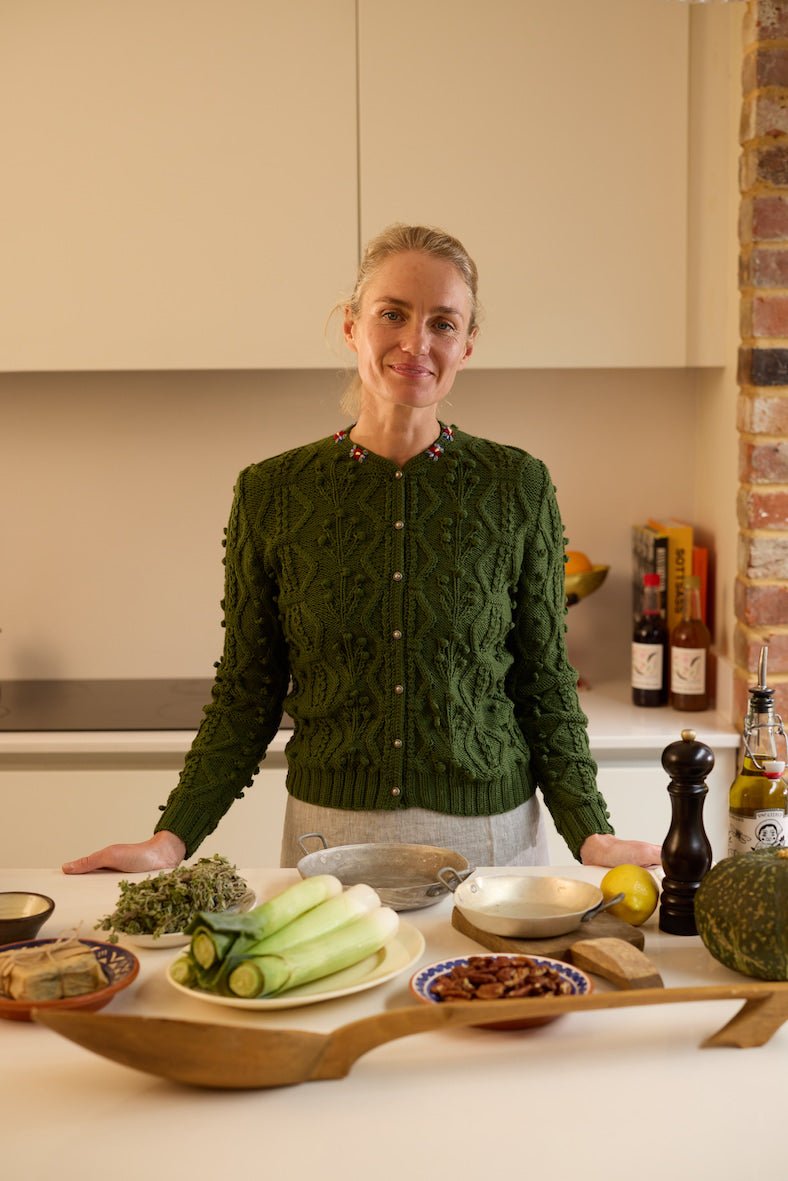 handknitted hunter green merino wool cardigan with cable knit