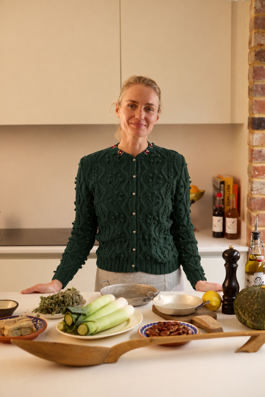 handknitted pine green merino wool cardigan with cable knit