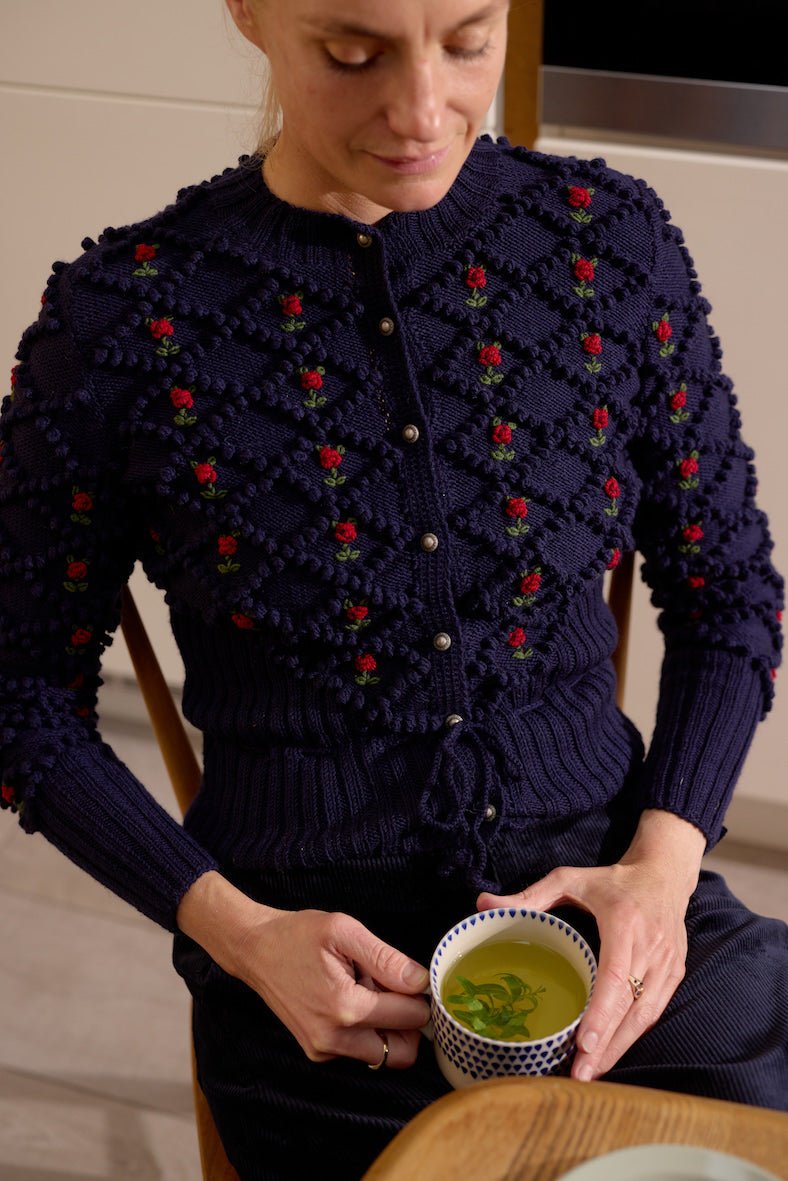 handknitted deep blue merino wool cardigan with embroidered flowers
