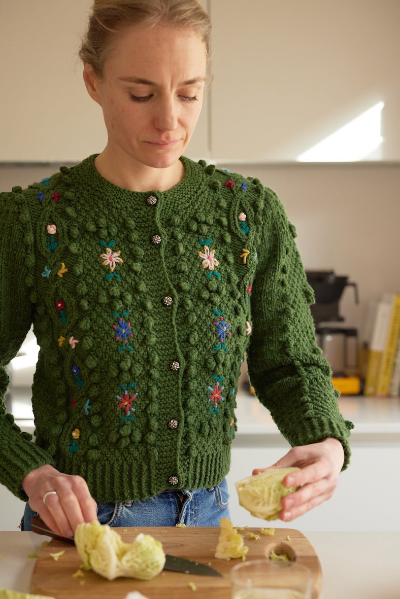 handknitted hunter green merino wool cardigan with floral embroidery