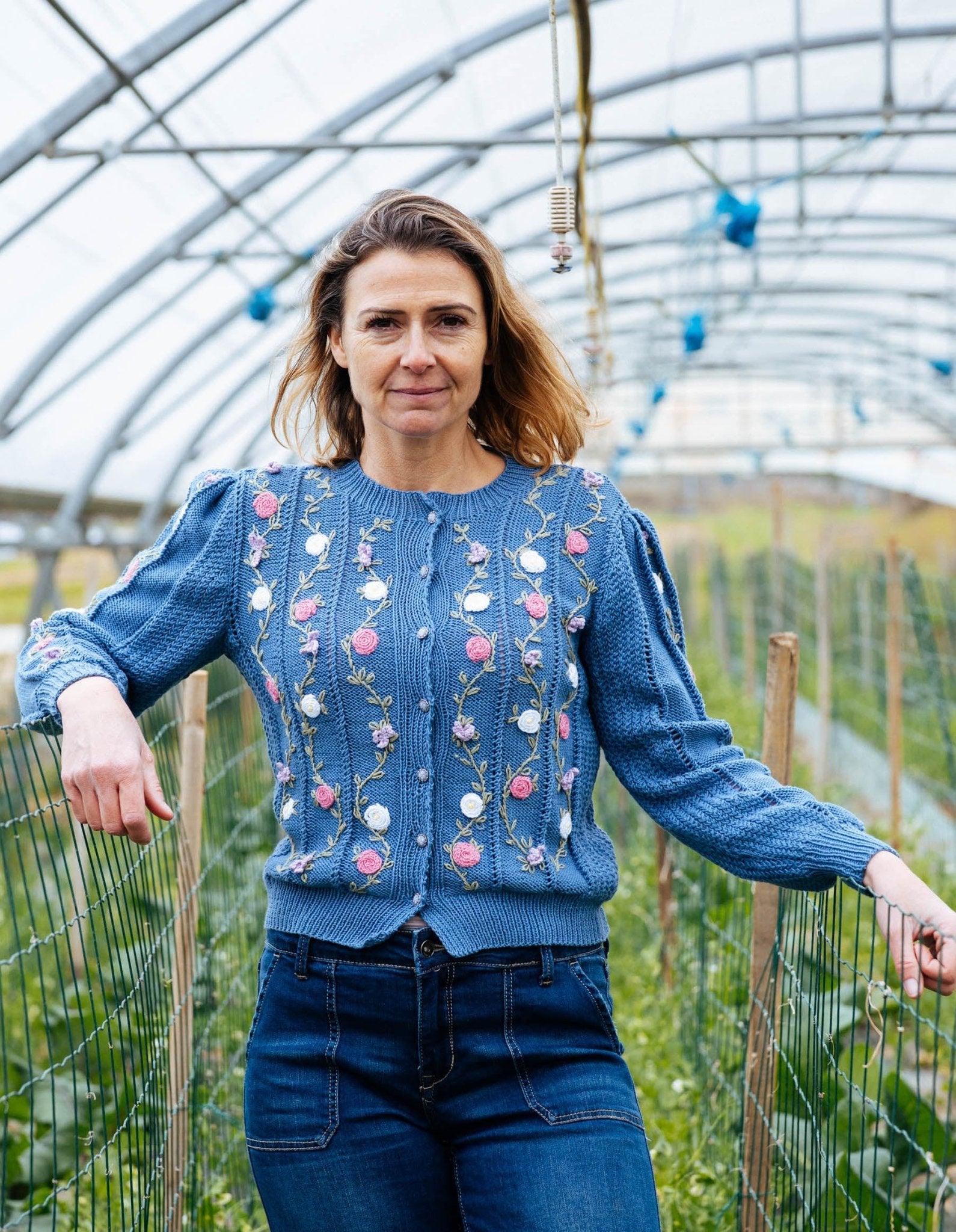 Front view of Rosina cardigan in alpine blue organic cotton with hand embroidered floral vines