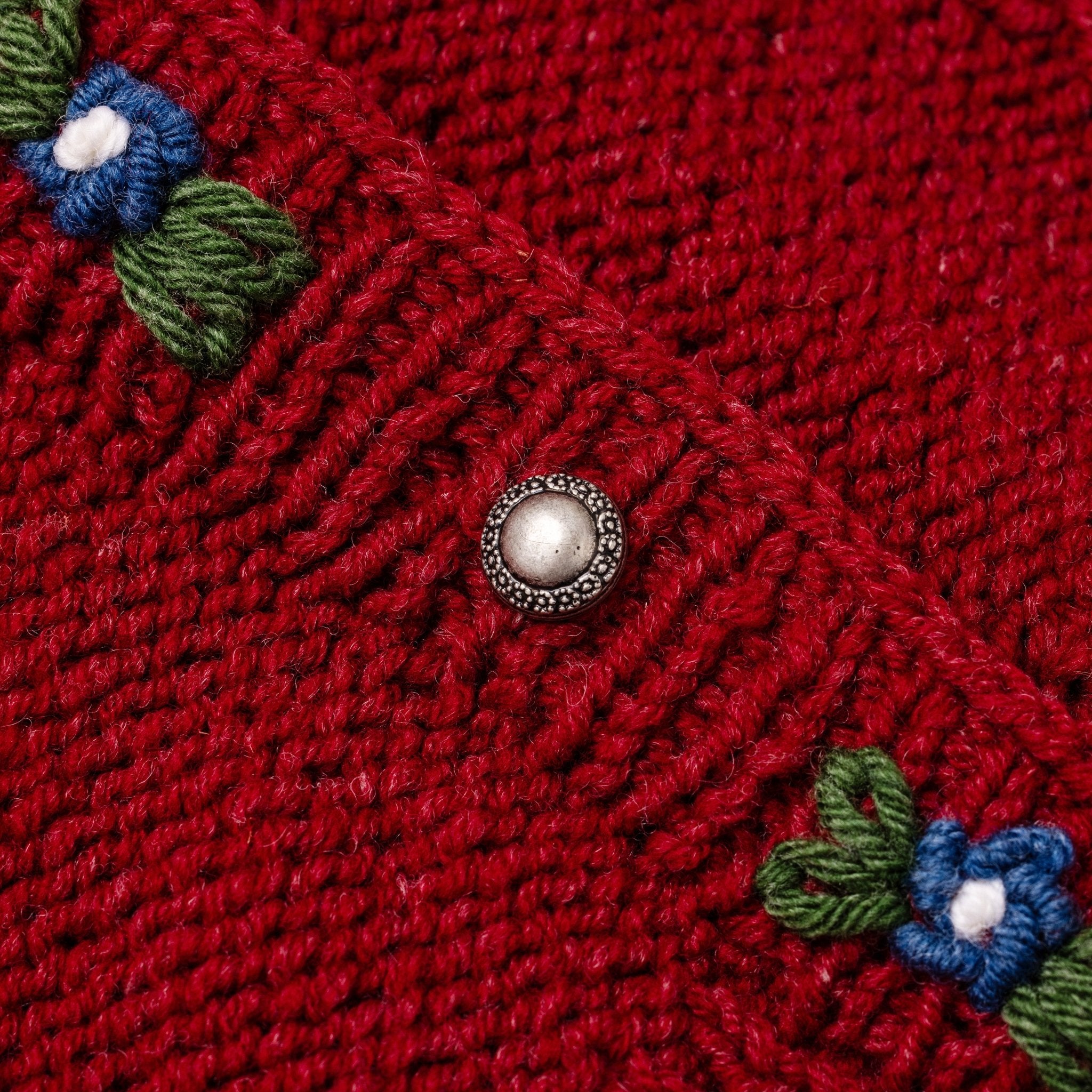deep red merino wool cardigan with embroidered floral placket
